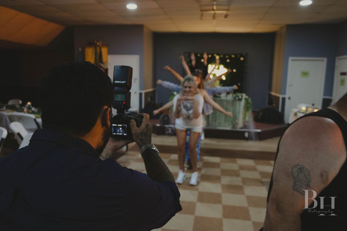 Brian photographing a dancer at an event