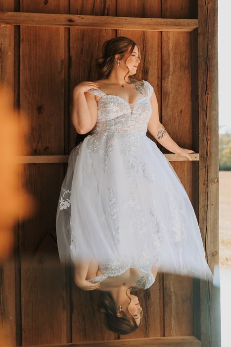 Bride in a rustic wooden doorway