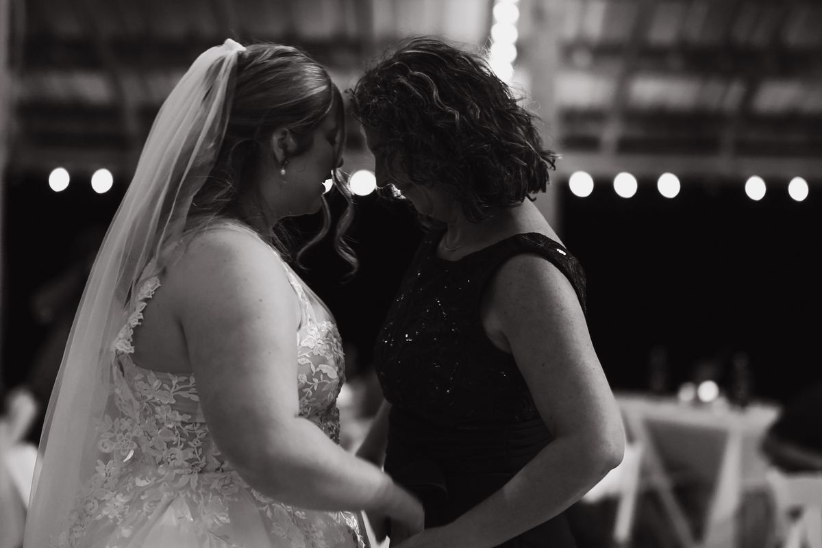 A long hug on the dance floor, black and white
