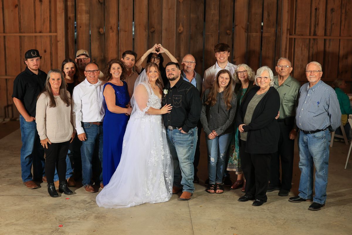 Knox and Rebecca with their families in the barn